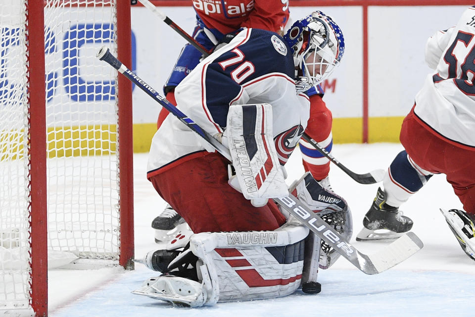 Columbus Blue Jackets goaltender Joonas Korpisalo (70) stops the puck during the first period of an NHL hockey game against the Washington Capitals, Monday, Dec. 9, 2019, in Washington. (AP Photo/Nick Wass)