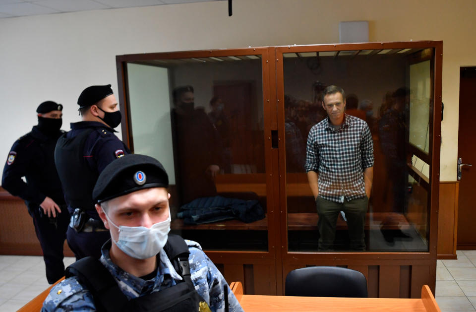 Navalny waits in a courtroom during a hearing on appellation to cancel the decision to replace his suspended sentence in the Yves Rocher fraud case with a jail term at Babushkinsky Court, Moscow, on Feb. 20.<span class="copyright">Pavel Bednyakov—Sputnik/AP</span>