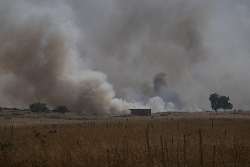 Smoke rises to the sky as a fire burns an area after a Lebanese shelling, in the Israeli-controlled Golan Heights, Thursday, June 13, 2024. (AP Photo/Leo Correa)