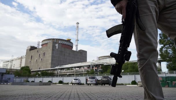 PHOTO: A security person stands in front of the Zaporizhzhia Nuclear Power Plant in Enerhodar, Ukraine, Sept. 11, 2022. (Stringer/AFP via Getty Images, FILE)