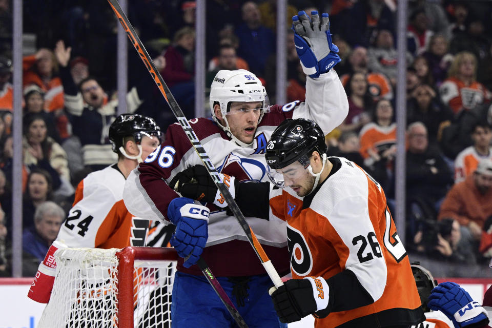 Colorado Avalanche's Mikko Rantanen (96) celebrates his goal past Philadelphia Flyers' Sean Walker (26) during the third period of an NHL hockey game, Saturday, Jan. 20, 2024, in Philadelphia. (AP Photo/Derik Hamilton)