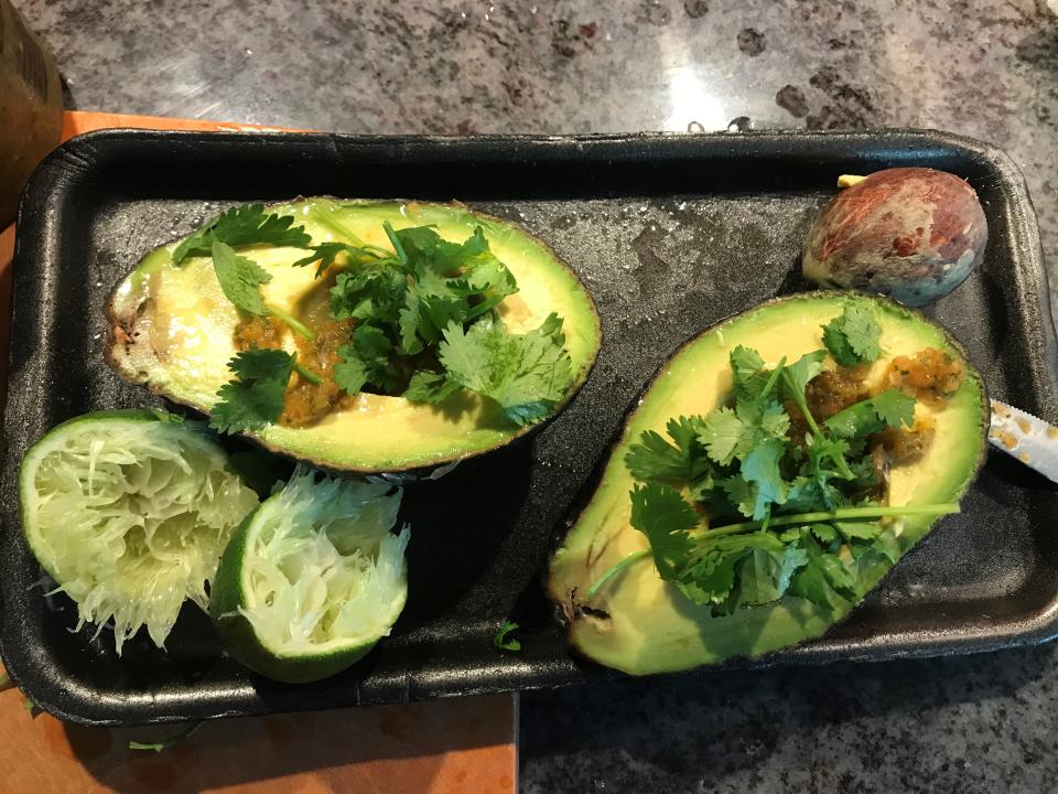 Avocado with cilantro for guacamole. Avocado is full of vitamins, especially E and C, as well as plenty of minerals.