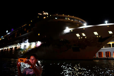 Yesica Ramirez takes a selfie near the cruise ship Norwegian Sky in Havana, Cuba, May 9, 2017. REUTERS/Alexandre Meneghini