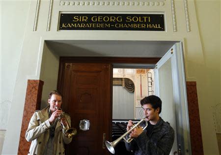 Student play trumpets in front of a new chamber opera house named for the late Jewish conductor Sir Georg Solti, who fled Nazi-allied Hungary before World War Two, at the Liszt Academy music school in Budapest October 21, 2013. REUTERS/Laszlo Balogh