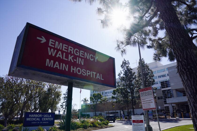 FILE - This Feb. 24, 2021 file photo shows an emergency room sign outside Harbor-UCLA Medical Center in Torrance, Calif. Health care in retirement is a big-ticket item, estimated to cost hundreds of thousands of dollars. But there are ways to take the reins and keep expenses from spiraling, even before you retire. Health savings accounts can help you save tax-deductible cash toward future medical costs. (AP Photo/Ashley Landis, File)