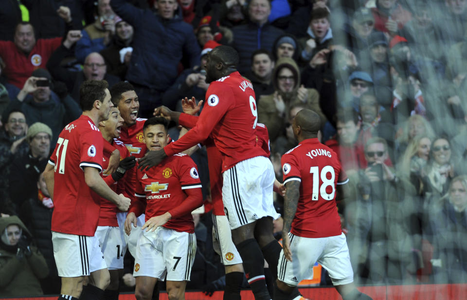 Manchester United’s Jesse Lingard, second left, celebrates with his teammates after scoring his side’s second goal