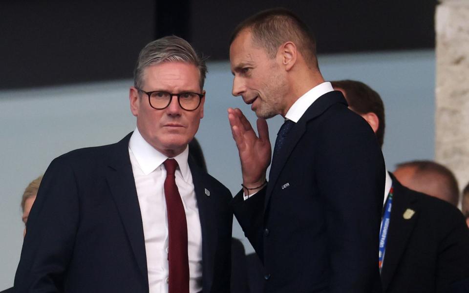 Sir Keir Starmer talks to Uefa president Aleksander Ceferin