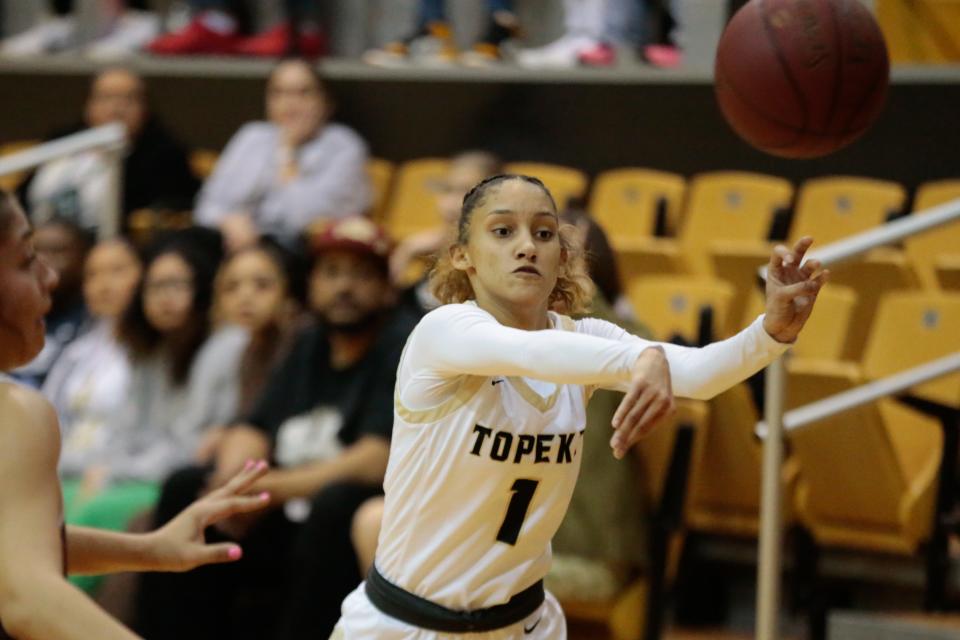 Topeka High junior Ladaysha Baird (1) passes the ball during the first half of the first round against Garden City in the KSHSAA 6A Sub-State tournament Wednesday.