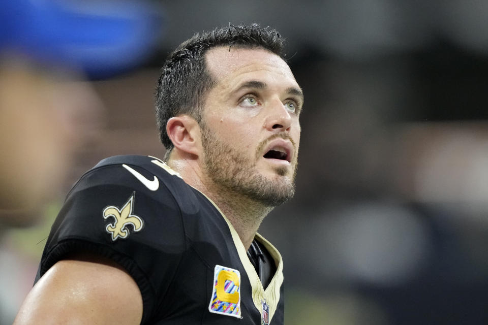 New Orleans Saints quarterback Derek Carr looks up at the scoreboard in the first half of an NFL football game against the Jacksonville Jaguars in New Orleans, Thursday, Oct. 19, 2023. (AP Photo/Gerald Herbert)