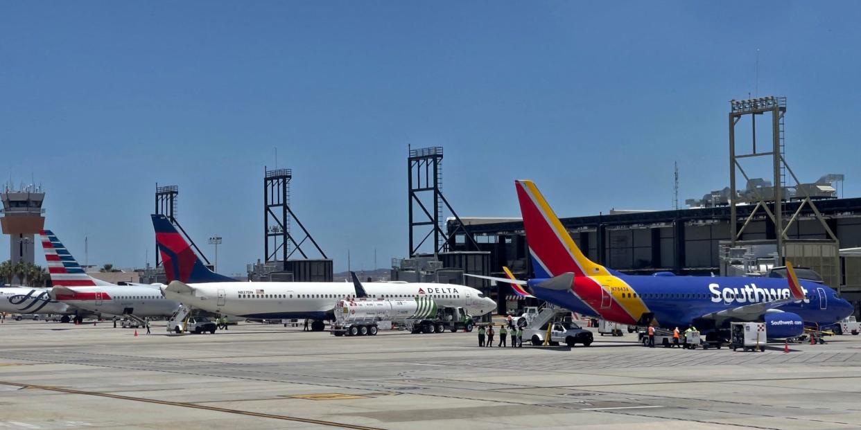 Southwest Airlines, Delta Air Lines, and American Airlines aircraft at an airport.