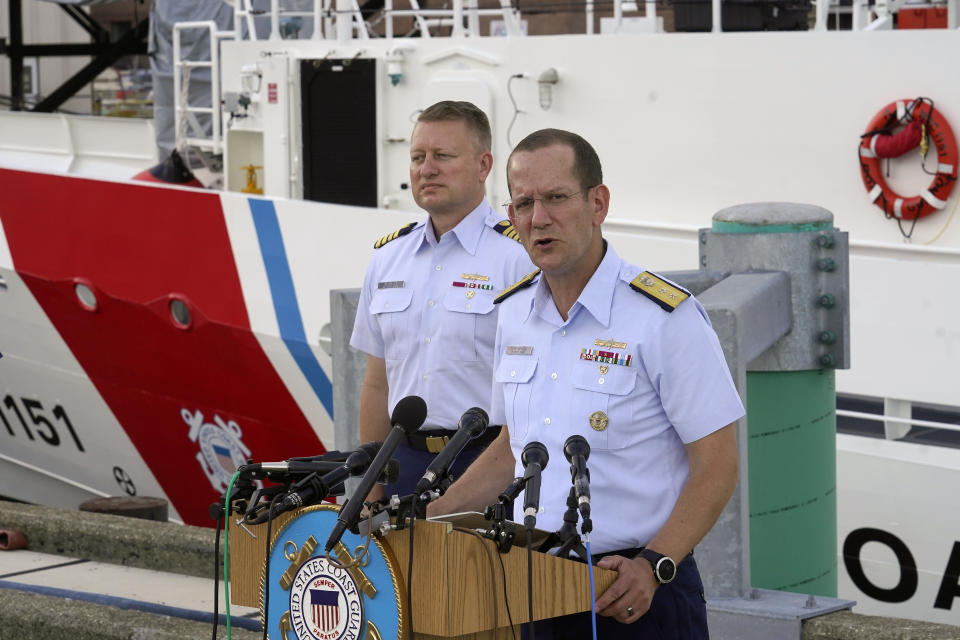 U.S. Coast Guard Rear Adm. John Mauger, commander of the First Coast Guard District, right, speaks to members of the media as Capt. Jason Neubauer, chief investigator, U.S. Coast, left, looks on during a news conference, Sunday, June 25, 2023, at Coast Guard Base Boston, in Boston. The U.S. Coast Guard said it is leading an investigation into the loss of the Titan submersible that was carrying five people to the Titanic, to determine what caused it to implode. (AP Photo/Steven Senne)