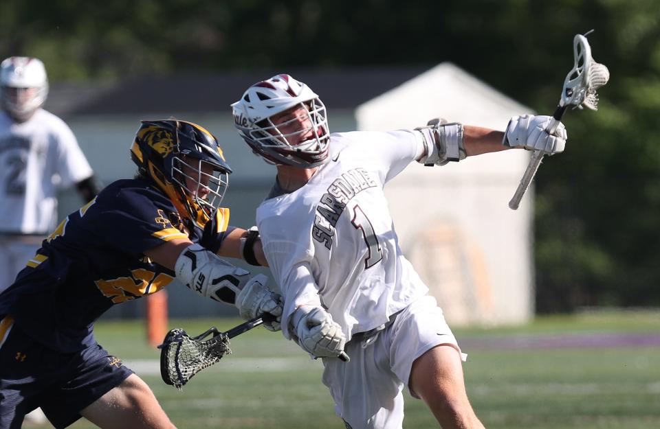 Scarsdale's Colby Baldwin (1) wins a face-off against Northport during the boys lacrosse Class A semifinal at University of Albany June 8, 2022.  Northport won the game.