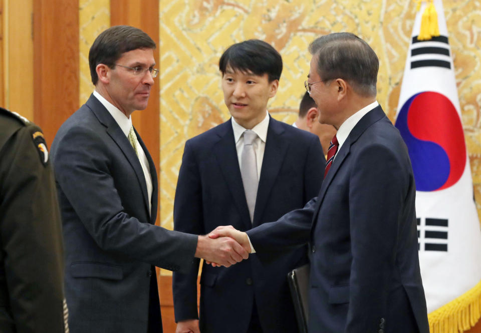 South Korean President Moon Jae-in, right, shakes hands with U.S. Defense Secretary Mark Esper, left, before a meeting at the presidential Blue House in Seoul, South Korea, Friday, Nov. 15, 2019. (Lee Jin-wook/Yonhap via AP)