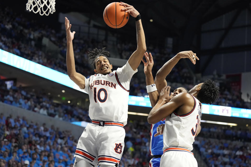 Auburn guard Chad Baker-Mazara (10) pulls down a rebound against Mississippi during the second half of an NCAA college basketball game, Saturday, Feb. 3, 2024, in Oxford, Miss. (AP Photo/Rogelio V. Solis)