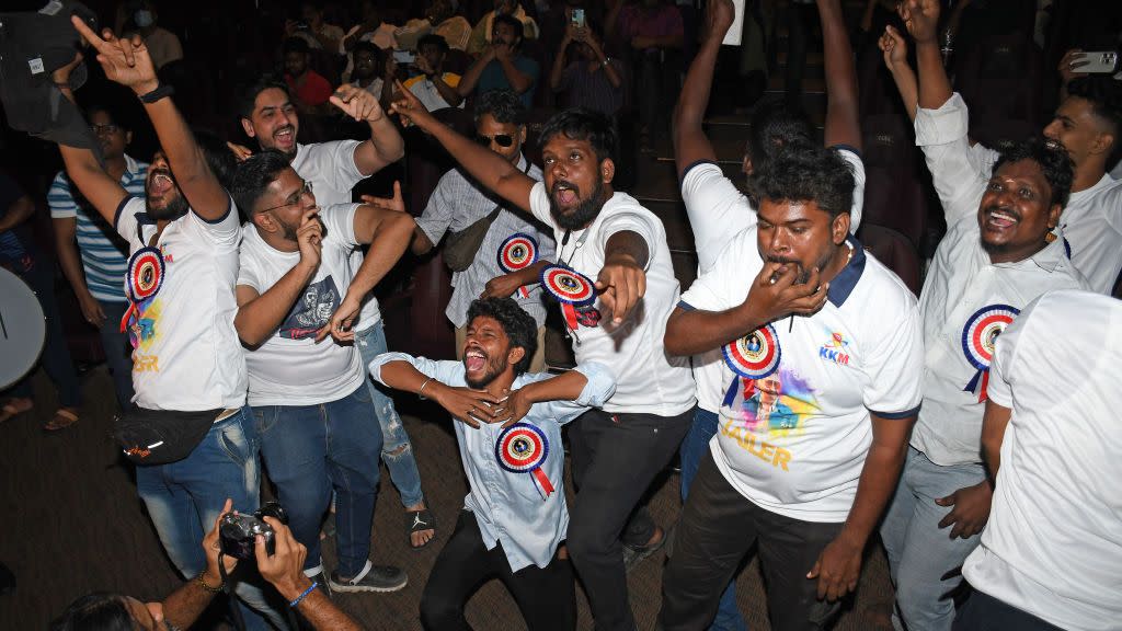 fans of indian film actor rajinikanth cheer and whistle