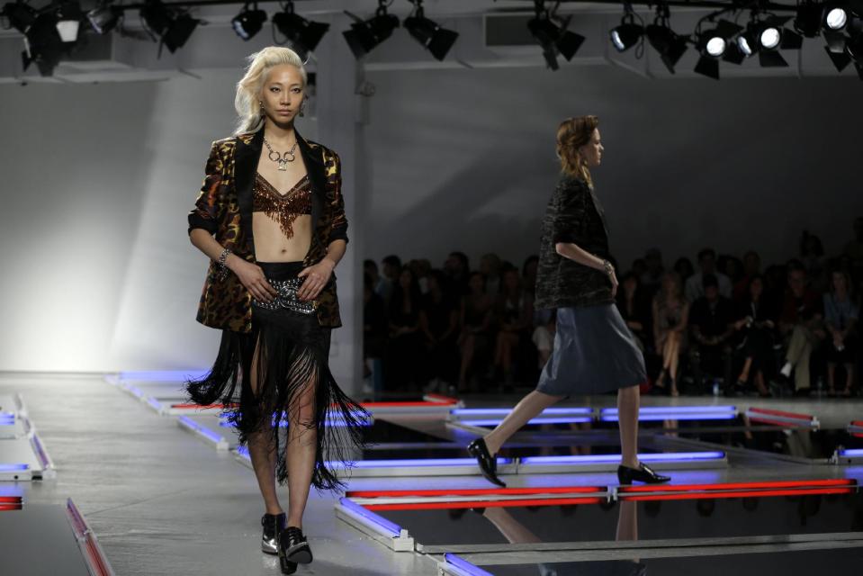 The Rodarte Spring 2014 collection is modeled during Fashion Week in New York, Tuesday, Sept. 10, 2013. (AP Photo/Seth Wenig)