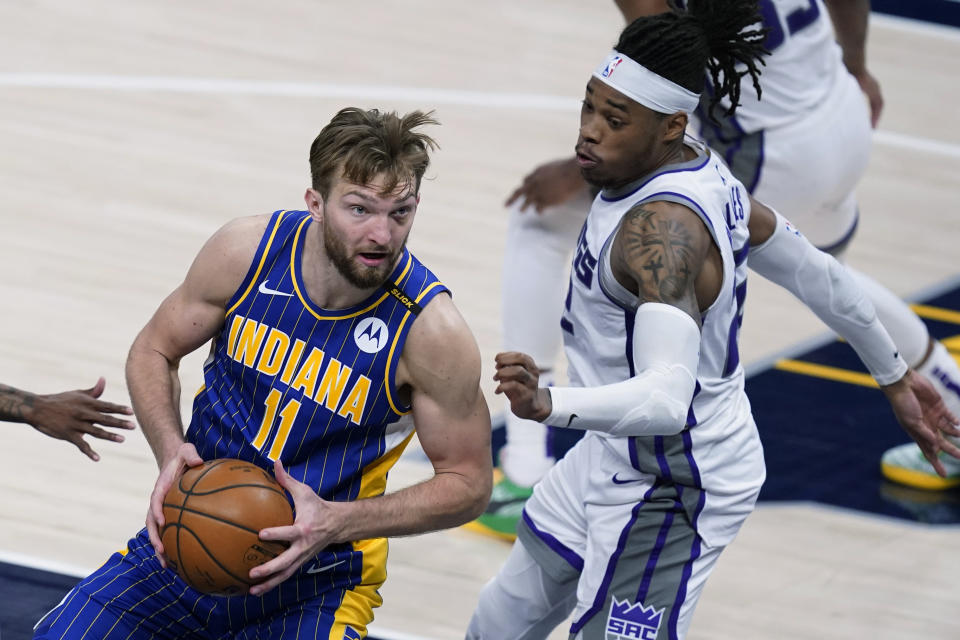 Indiana Pacers' Domantas Sabonis (11) goes to the basket against Sacramento Kings' Richaun Holmes (22) during the second half of an NBA basketball game Wednesday, May 5, 2021, in Indianapolis. (AP Photo/Darron Cummings)