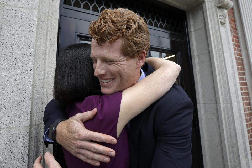 FILE - In this Aug. 27, 2019 file photo, U.S. Rep. Joe Kennedy III, D-Mass., hugs Newton Mayor Ruthanne Fuller on the way into a fire station in Newton, Mass. Kennedy plans to announce on Saturday, Sept. 21, that he will challenge U.S. Sen. Edward Markey, D-Mass., in the 2020 Democratic primary. (AP Photo/Elise Amendola, File)