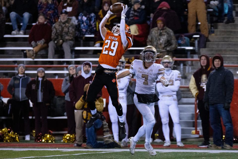 Byron high school running back Kye Aken (29) jumps up to intercept the ball from Mt. Carmel wide receiver Andrew Gillihan (7) during the 3A state championship game on Nov. 24, 2023 at Hancock stadium. Byron led at the first half with a score of 49-0.