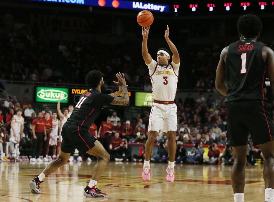 Iowa State Cyclones guard Tamin Lipsey (3) takes a three-point shot over Houston Cougars guard Damian Dunn (11) during the first half in the Big-12 conference showdown of an NCAA college basketball at Hilton Coliseum on Tuesday, Jan. 9, 2024, in Ames, Iowa.