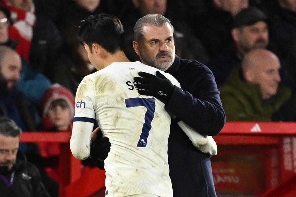 Tottenham Hotspur manager Ange Postecoglou embraces forward Son Heung-min. 