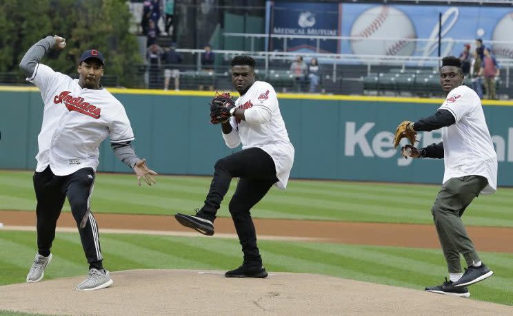 Cleveland Browns first-round draft picks Myles Garrett (left), Jabrill Peppers (middle) and David Njoku (right) throw out ceremonial first pitches before Friday's Indians game at Progressive Field. (AP)