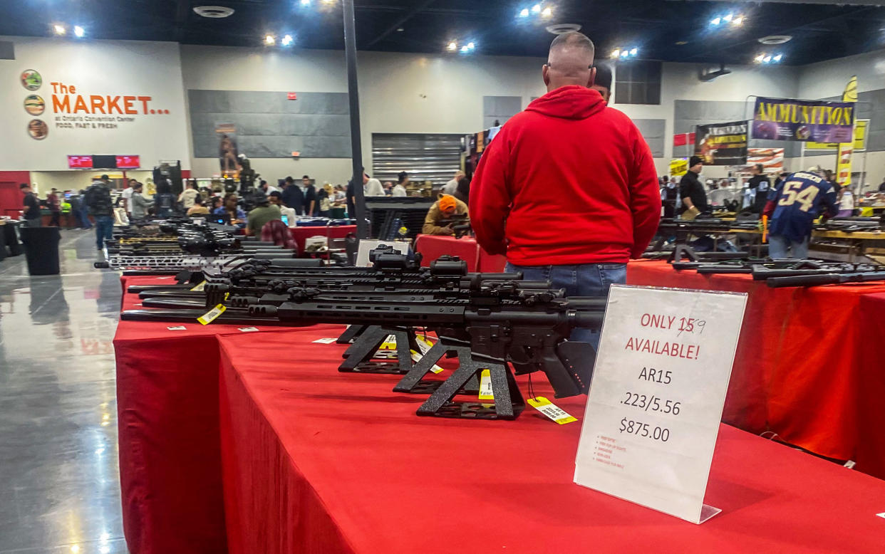 AR15 rifles are displayed for sale at a gun show (Apu Gomes / AFP via Getty Images file)