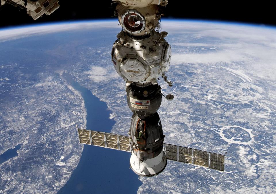 This undated handout photo taken by Russian cosmonaut Sergei Korsakov and released by Roscosmos State Space Corporation shows a Soyuz capsule of the International Space Station (ISS) during its fly. Russian space corporation Roscosmos said that a coolant leak from a Russian space capsule attached to the International Space Station that prompted a pair of Russian cosmonauts to abort a planned spacewalk was likely caused by a micrometeorite. (Sergei Korsakov, Roscosmos State Space Corporation via AP)