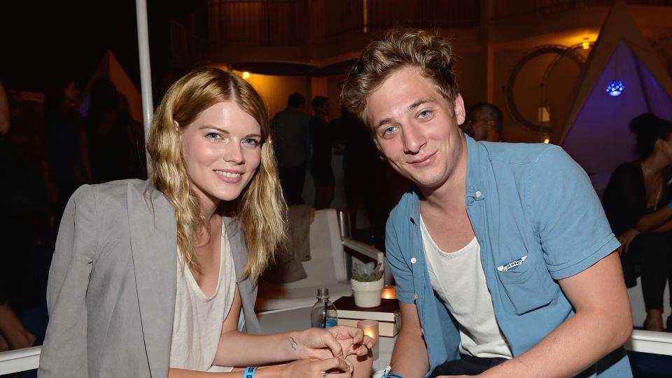 Emma Greenwell (L) and actor Jeremy Allen White attend Warby Parker's store opening in The Standard, Hollywood on August 15, 2013 in Los Angeles, California