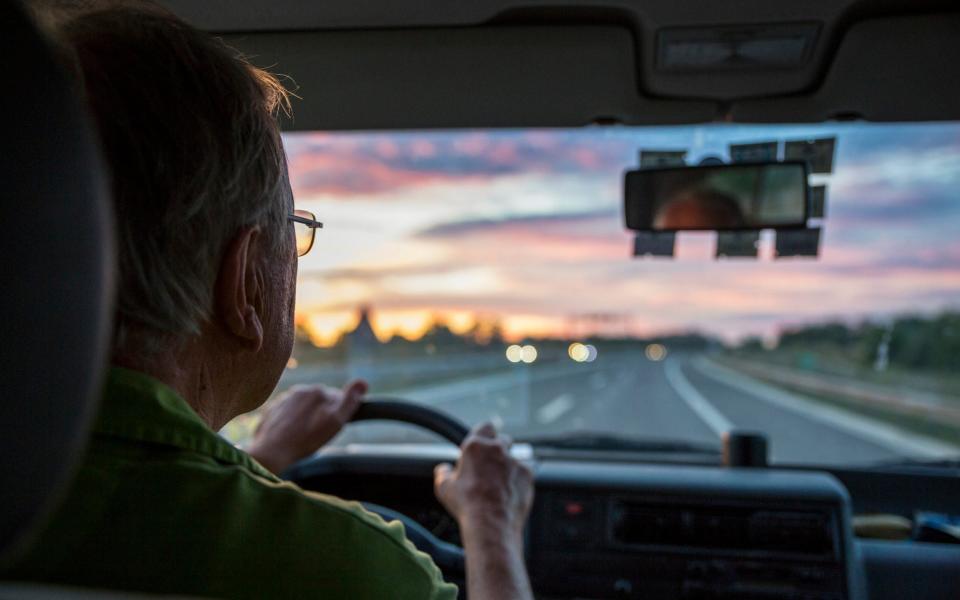 driver on roads at dusk - Getty