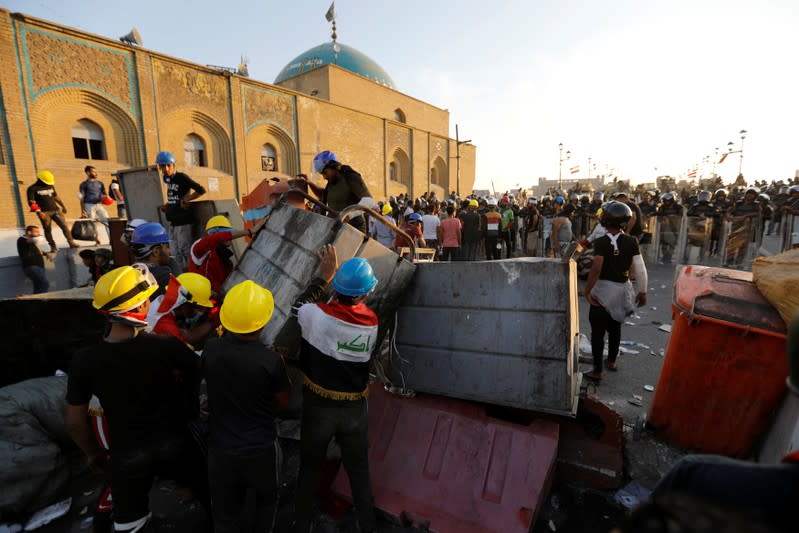 Demonstrators block Al Shuhada bridge during ongoing anti-government protests, in Baghdad