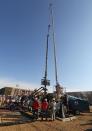 In this March 25, 2014 photo, perforating tools, used to create fractures in the rock, are lowered into one of six wells during a roughly two-week hydraulic fracturing operation at an Encana Corp. well pad near Mead, Colo. Proponents of hydraulic fracturing point to the economic benefits from vast amounts of formerly inaccessible hydrocarbons that now can be extracted with hydraulic fracturing. Opponents point to potential environmental impacts, with some critics acknowledging that some fracking operations are far cleaner than others. (AP Photo/Brennan Linsley)