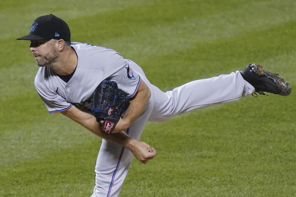 Miami Marlins relief pitcher Brandon Kintzler watches a throw during the seventh inning in the first baseball game of the team's doubleheader against the New York Mets, Tuesday, Aug. 25, 2020, in New York. (AP Photo/John Minchillo)