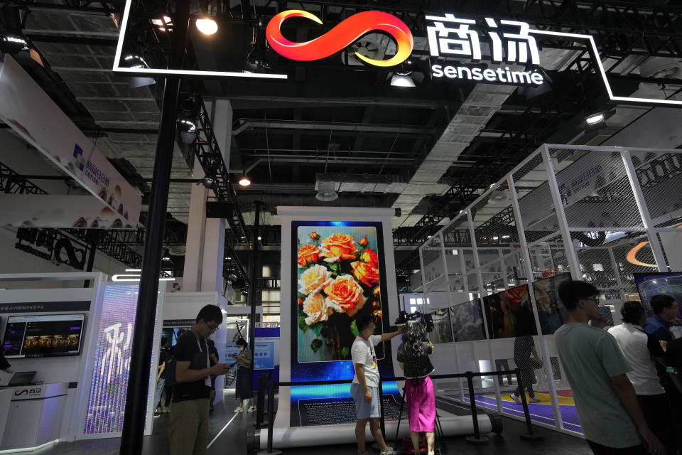 The booth for Chinese artificial intelligence company Sensetime demonstrates its AI generated images during the World AI Conference in Shanghai, Wednesday, July 5, 2023. SenseTime, a major Chinese artificial intelligence company known for its facial recognition technology, has rejected claims by a research company that it has inflated its revenue. (AP Photo/Ng Han Guan)