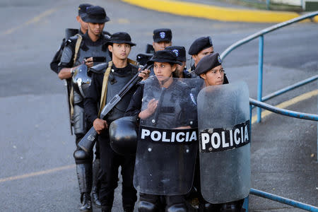 Riot police stand guard in front of 100% Noticias Channel building after its director Miguel Mora was arrested by national police in Managua, Nicaragua December 22, 2018. REUTERS/Oswaldo Rivas