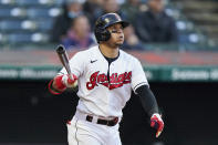 Cleveland Indians' Cesar Hernandez watches his ball after hitting a two-run home run in the fifth inning of a baseball game against the Chicago Cubs, Tuesday, May 11, 2021, in Cleveland. (AP Photo/Tony Dejak)