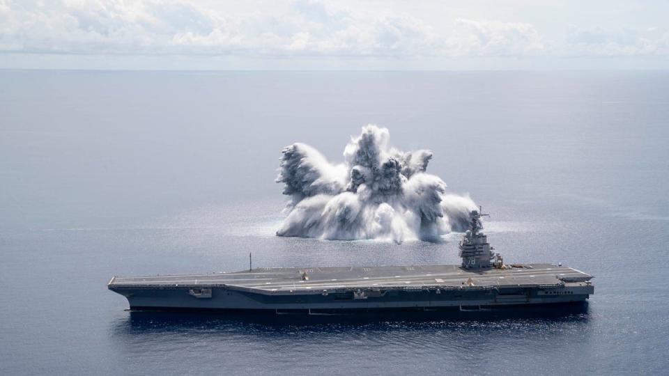 In this file handout image courtesy of the US Navy taken on June 18, 2021 the aircraft carrier USS Gerald R. Ford (CVN 78) completes the first scheduled explosive event of Full Ship Shock Trials while underway in the Atlantic Ocean (US NAVY/AFP via Getty Images)