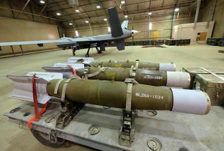 Three 500-pound bombs wait to be loaded on U.S. Air Force drones at Kandahar Airfield, Afghanistan March 9, 2016. To match Exclusive AFGHANISTAN-DRONES/ REUTERS/Josh Smith/File Photo