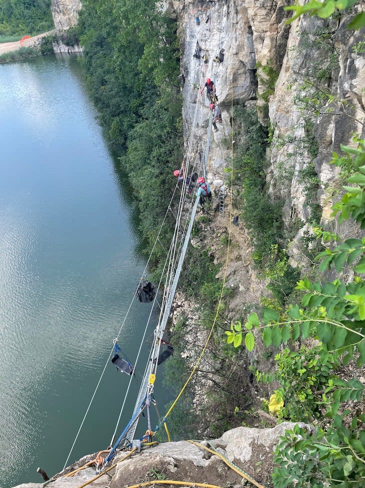 Cable suspension bridge over a rock quarry