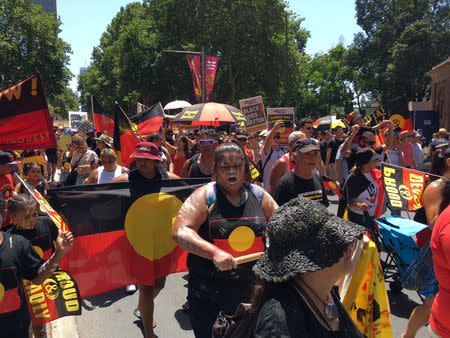 People carry Australian Aboriginal flags during a demonstration on Australia Day in Sydney, January 26, 2019. REUTERS/Stefica Nicol Bikes