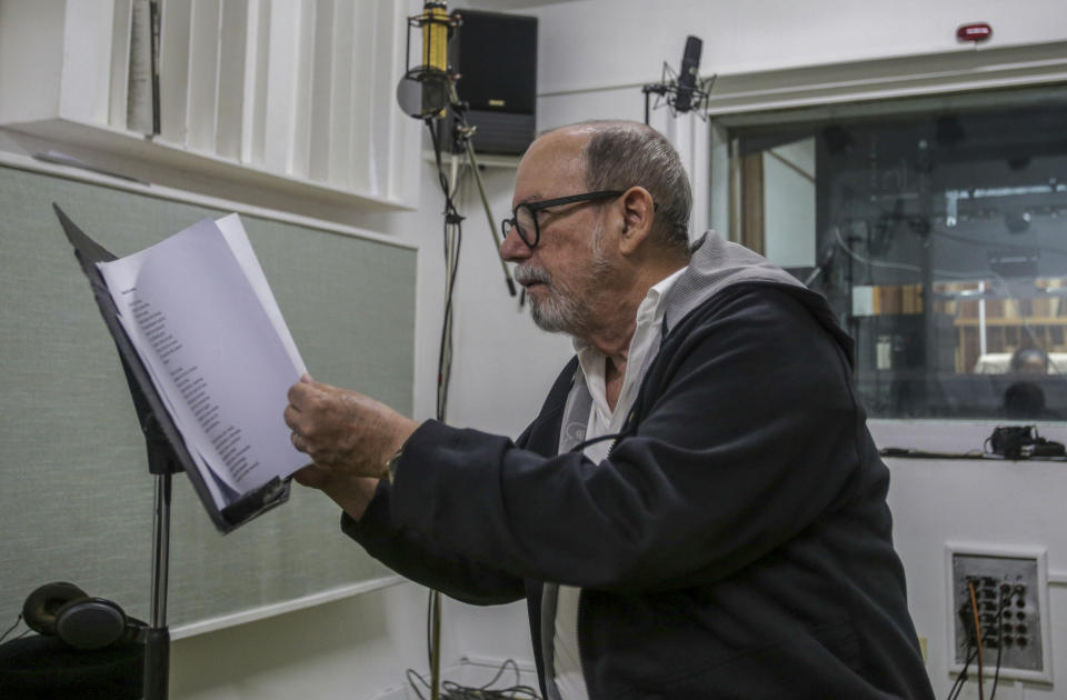 Cuban musician Silvio Rodriguez pages through lyrics during an interview with The Associated Press in Havana, Cuba, Thursday, June 6, 2024. His new album, “Quería saber,” or "I Wanted to Know," includes 11 songs written between 2019 and 2023, some of which express disappointment in the path his country is taking. (AP Photo/Ariel Ley)