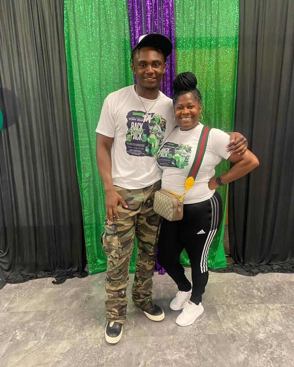 Tony Adams, safety for the New York Jets, and Sukeena Gunner, mother of the late Jaylon McKenzie, in July 2023 at Backpack event. Adams announced a scholarship in honor of McKenzie