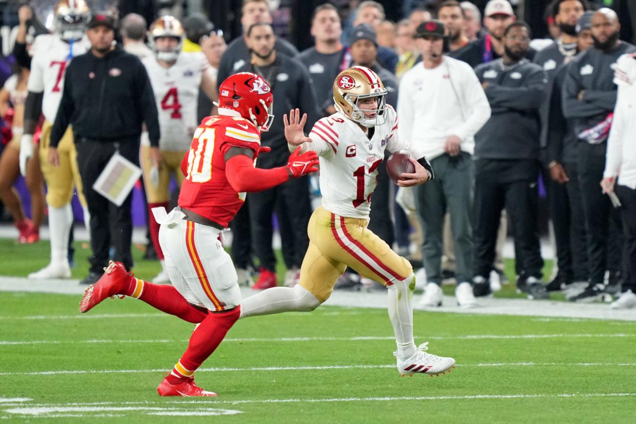 Feb 11, 2024; Paradise, Nevada, USA; San Francisco 49ers quarterback Brock Purdy (13) runs with the ball against Kansas City Chiefs linebacker Willie Gay (50) during the third quarter of Super Bowl LVIII at Allegiant Stadium. Mandatory Credit: Kyle Terada-USA TODAY Sports