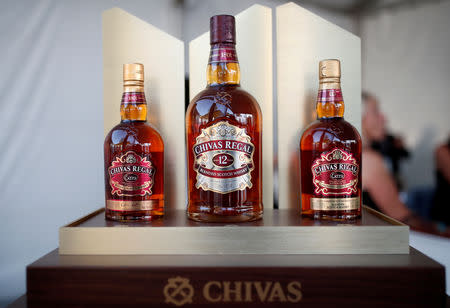 FILE PHOTO: Bottles of Chivas Regal blended Scotch whisky, produced by Pernod Ricard SA, are displayed on the campus of the HEC School of Management in Jouy-en-Josas, near Paris, France August 28, 2018. REUTERS/Benoit Tessier/File Photo