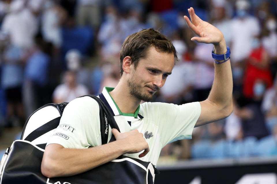 Daniil Medvedev of Russia waves after defeating Maxime Cressy of the U.S. following their fourth round match at the Australian Open tennis championships in Melbourne, Australia, Monday, Jan. 24, 2022. (AP Photo/Hamish Blair)