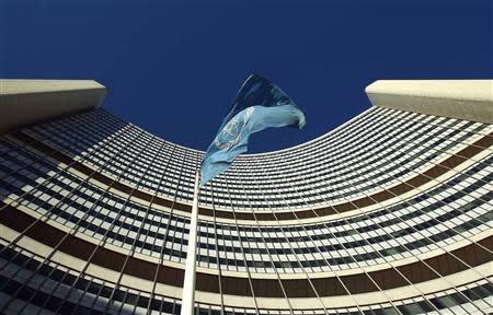 The flag of the International Atomic Energy Agency (IAEA) flies in front of its headquarters during a board of governors meeting in Vienna November 28, 2013. REUTERS/Heinz-Peter Bader