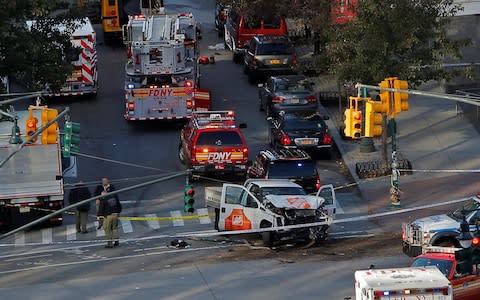 Emergency crews attend the scene of a the terror attack in New York - Credit: REUTERS/Andrew Kelly