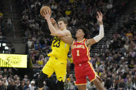 Atlanta Hawks forward Jalen Johnson (1) defends against Utah Jazz forward Lauri Markkanen (23) during the second half of an NBA basketball game Friday, Feb. 3, 2023, in Salt Lake City. (AP Photo/Rick Bowmer)