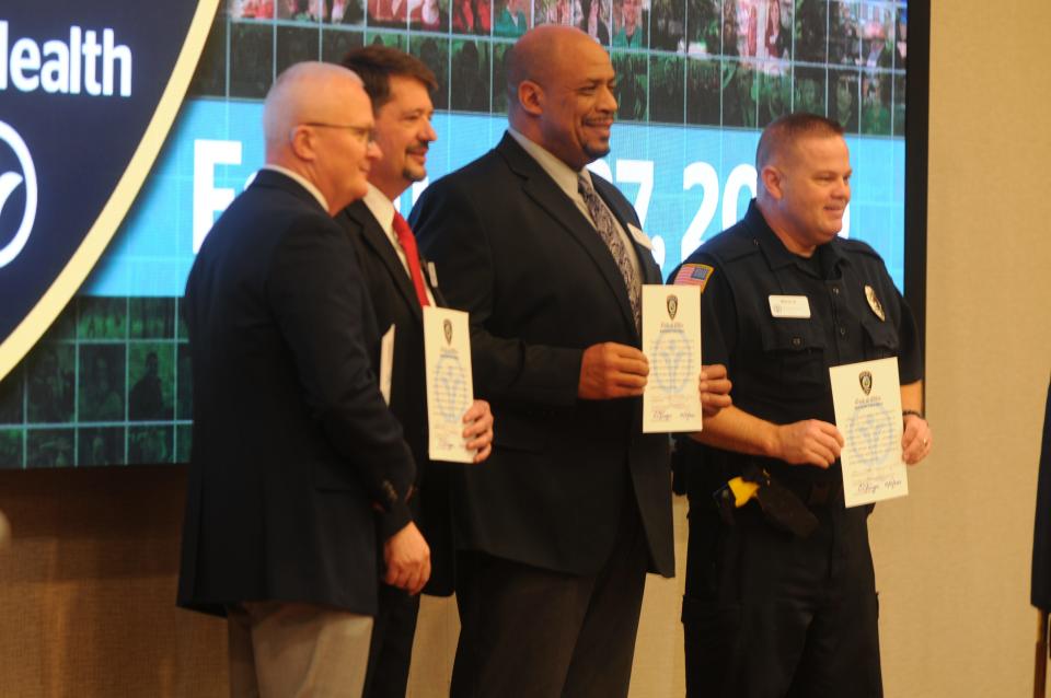 Chief Randy Kolentus (from left), Assistant Chief Jeff Cappa, Capt. Dennis Perkins and Officer Steve Smith took their oaths Thursday, Feb. 27, 2020, as the Reid Health Police Force's first officers.