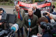 Former Greek Finance Minister Yanis Varoufakis talks to the media as he leaves Belmarsh Prison after visiting Julian Assange, in London